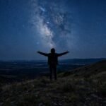 Person gazing at starry night sky for dream quotes